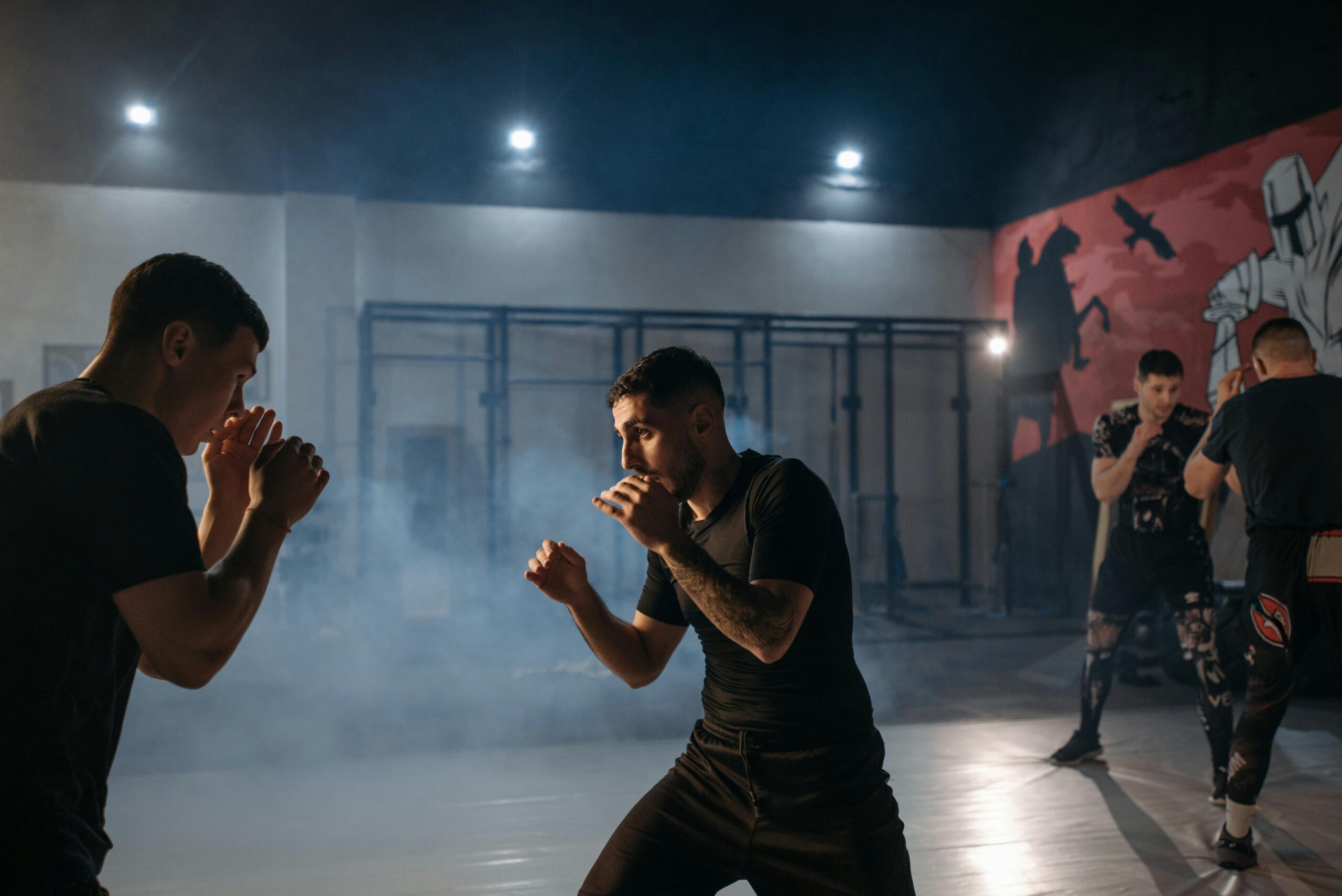 Boxers sparring in a gym, capturing the intensity and focus of training.